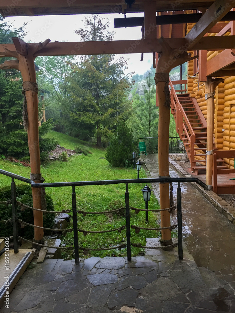 Fototapeta premium View of a tranquil garden from a wooden porch