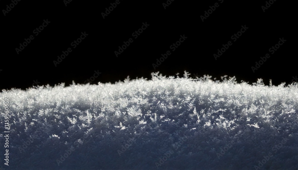 close up of snow shapes on black background close up of snow shapes on black background