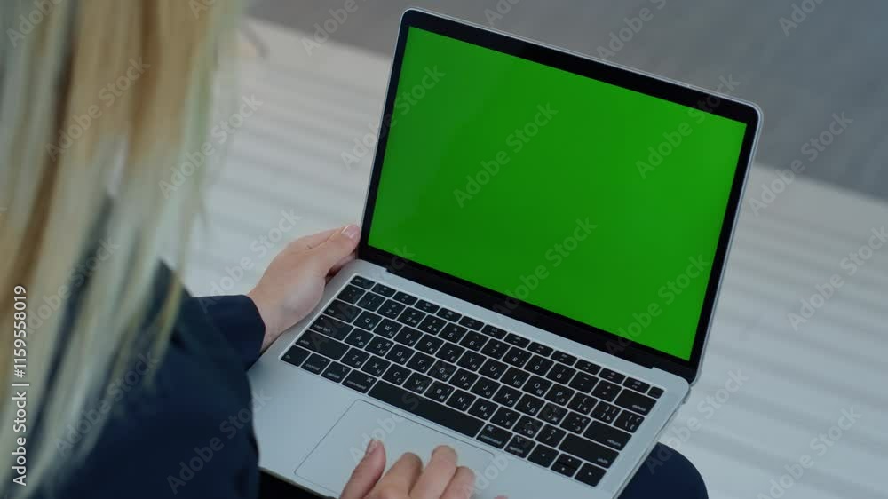 Freelancer browsing greenscreen laptop application at remote workplace closeup. Freelancer browsing greenscreen laptop application at remote workplace closeup.