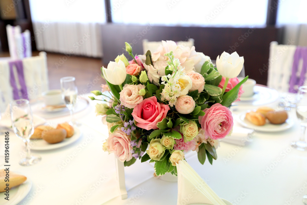 Beautiful table setting with tableware, flowers, accessories and beautiful rose for a party, wedding reception or holiday event. Photographed in ambiental light. Beautiful table setting with tableware, flowers, accessories and beautiful rose for a party, wedding reception or holiday event. Photographed in ambiental light.