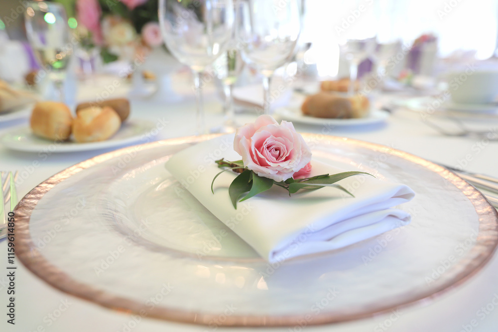Beautiful table setting with tableware, flowers, accessories and beautiful rose for a party, wedding reception or holiday event. Photographed in ambiental light. Beautiful table setting with tableware, flowers, accessories and beautiful rose for a party, wedding reception or holiday event. Photographed in ambiental light.