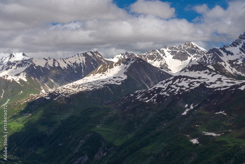 Beautiful mountain scenery in the Alps. Picturesque mountain landscape with cloudy sky. Beautiful mountain scenery in the Alps. Picturesque mountain landscape with cloudy sky.