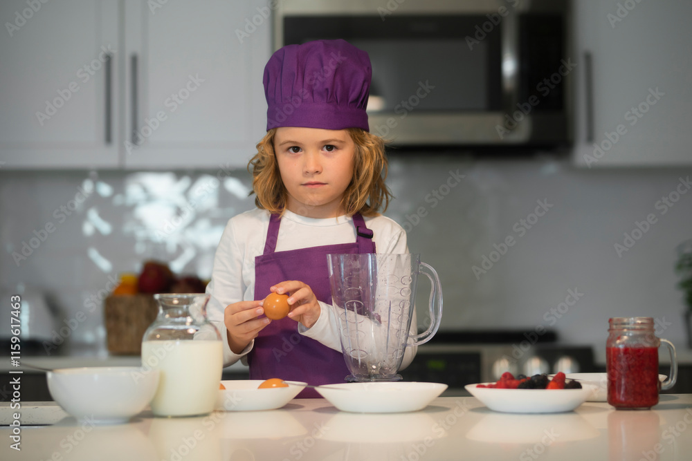 Chef child cooking. Chef child cook baking on the kitchen. Chef child cooking. Chef child cook baking on the kitchen.