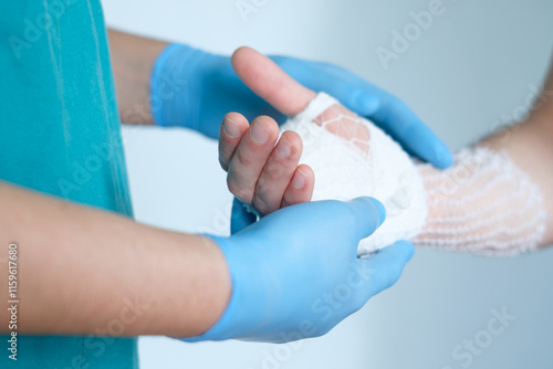 Photography close up of doctor bandaging one hand
