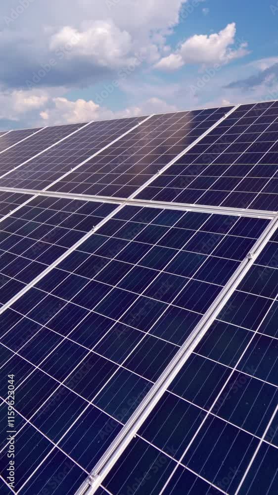 Blue solar panel under blue sky. Production of clean alternative energy. New energy concept. Close-up. Vertical video Blue solar panel under blue sky. Production of clean alternative energy. New energy concept. Close-up. Vertical video