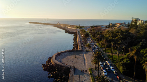 Vista capturando a deslumbrante paisagem do Porto e de Matosinhos, onde o Rio Douro encontra o Oceano Atlântico. A cena apresenta as areias douradas da praia de Matosinhos,  photo