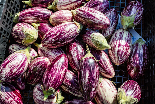 Aubergines for sale at a market stall