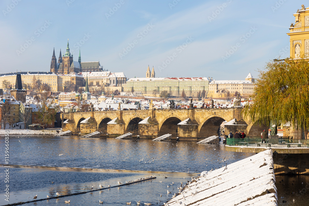 Snowy Prague Lesser Town with Prague Castle above River Vltava, Czech republic