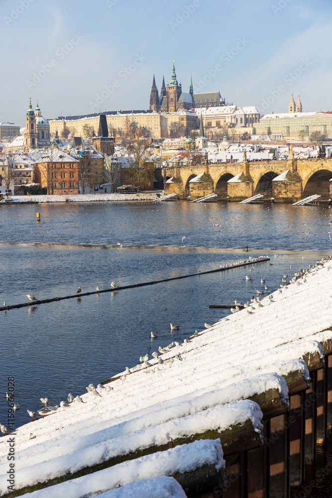 Snowy Prague Lesser Town with Prague Castle above River Vltava, Czech republic
