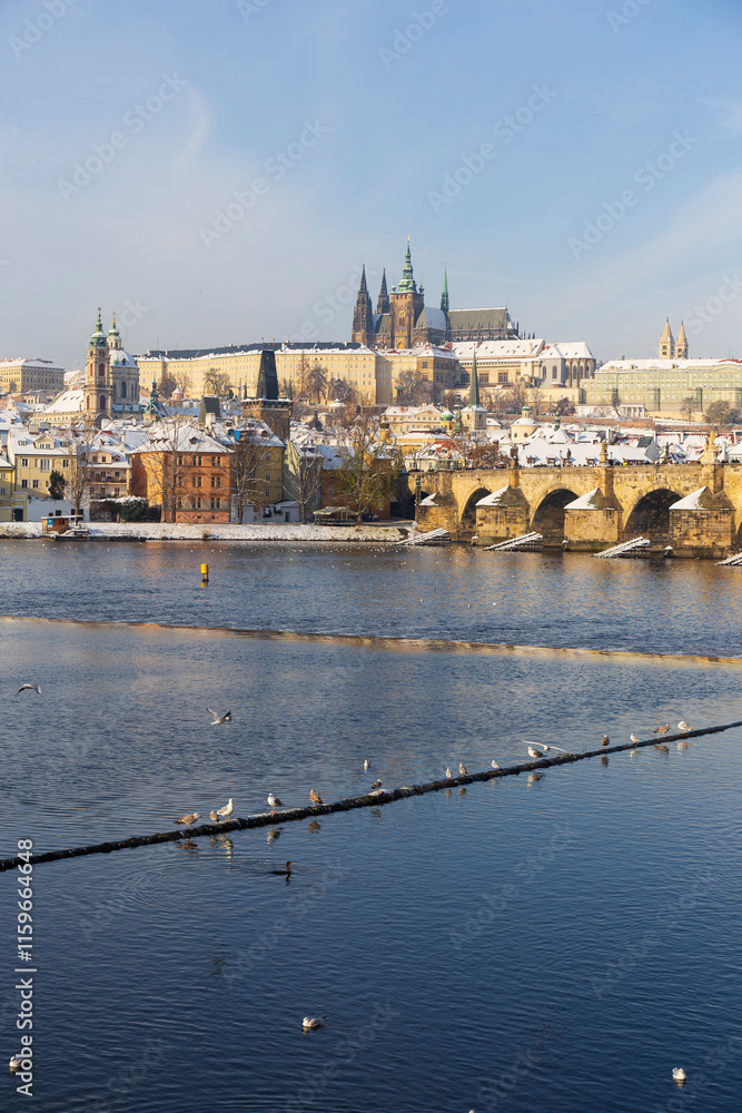 Snowy Prague Lesser Town with Prague Castle above River Vltava, Czech republic