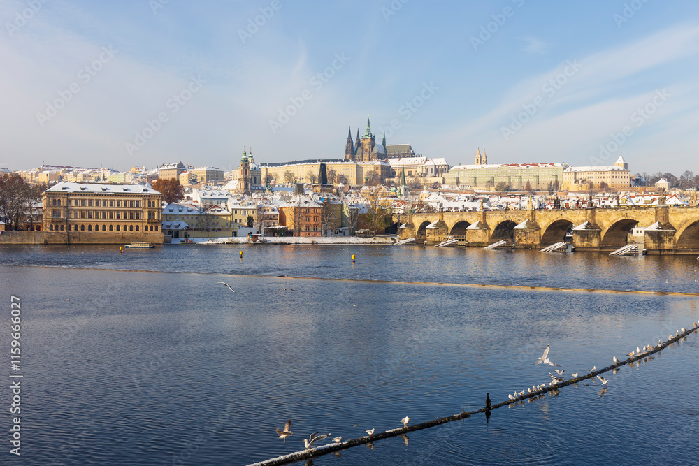 Snowy Prague Lesser Town with Prague Castle above River Vltava, Czech republic