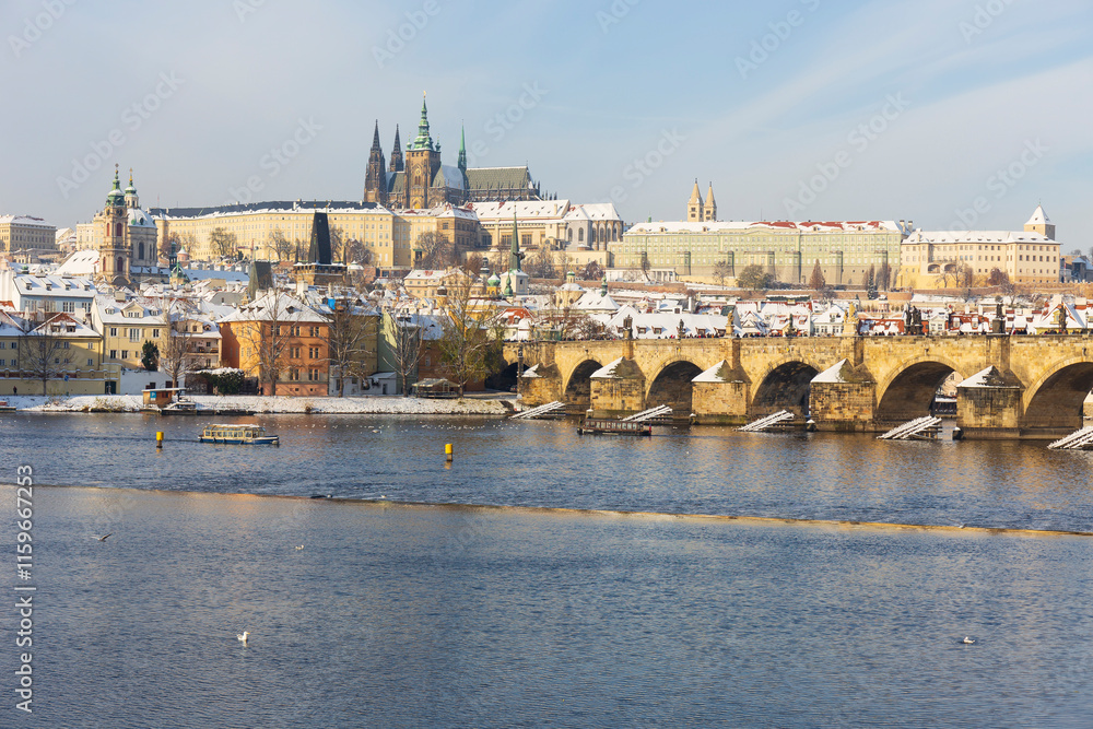 Snowy Prague Lesser Town with Prague Castle above River Vltava, Czech republic