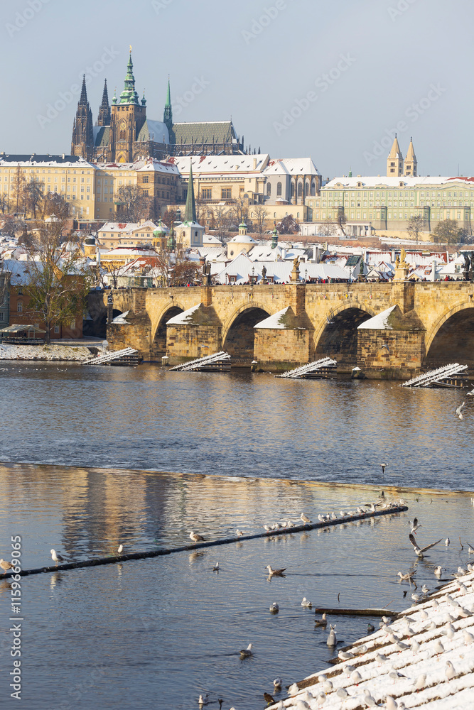 Snowy Prague Lesser Town with Prague Castle above River Vltava, Czech republic