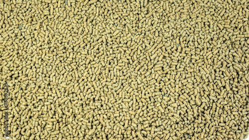 Shrimp food or fish food in the form of small, long pellets, animal food background
