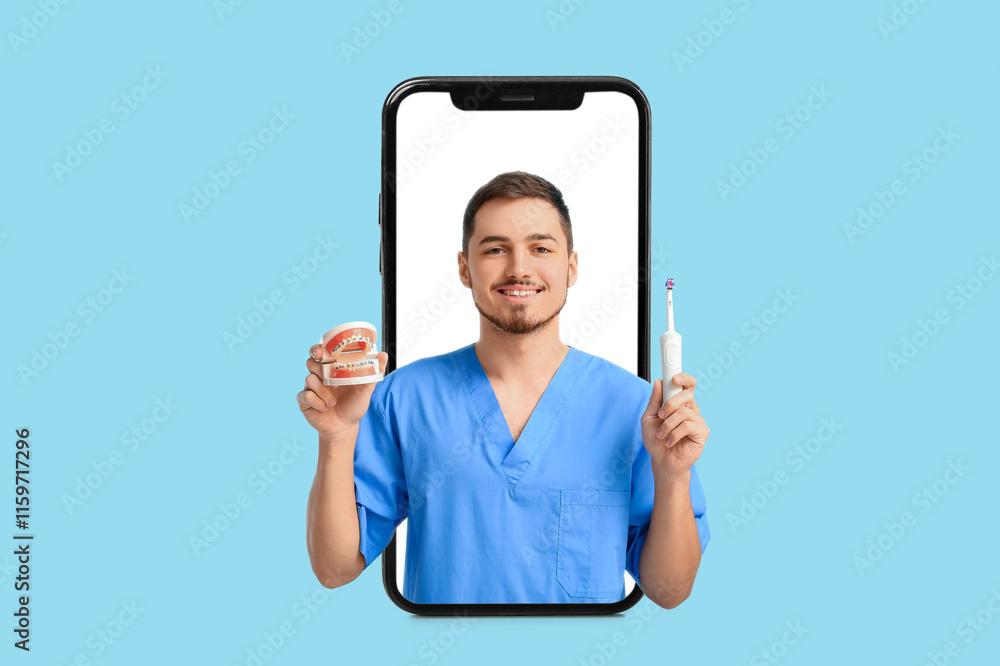 © Pixel-Shot - Male dentist with plastic jaw model and electric toothbrush on light turquoise background