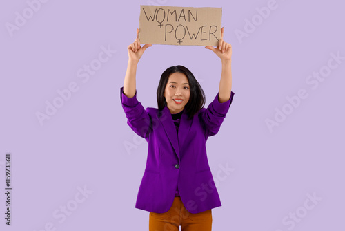 Young Asian girl holding pa...