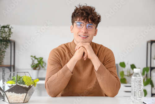 Young man video chatting at...