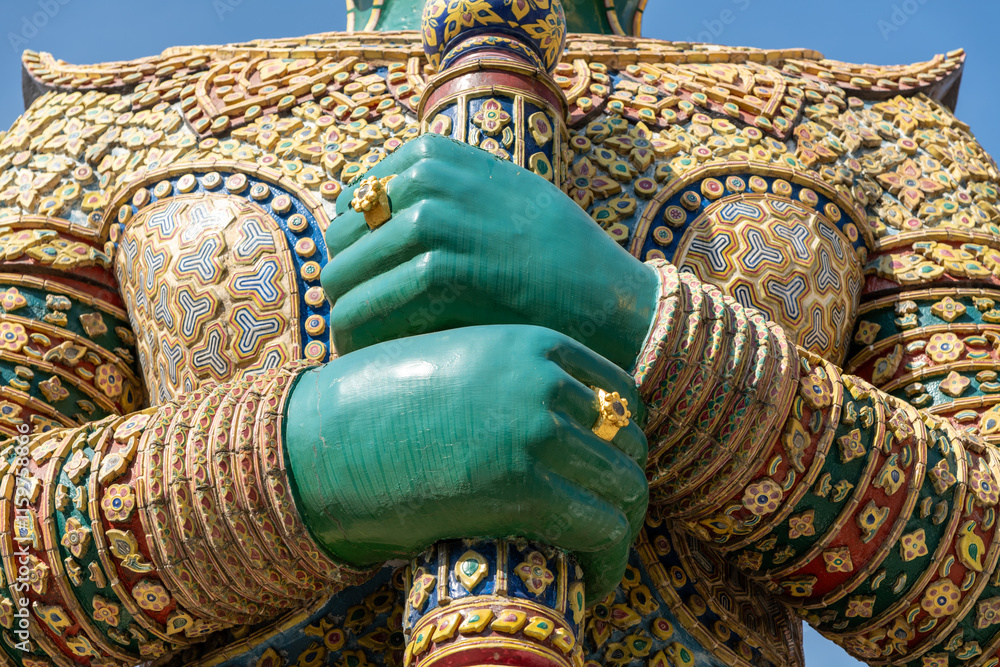 Large, colorful statue at the Palace of the Emerald Buddha in Bangkok Large, colorful statue at the Palace of the Emerald Buddha in Bangkok