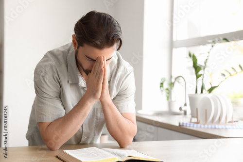 Religious man with Bible pr...