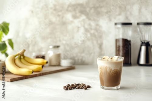 Frozen banana espresso latte in a vegan non dairy blend on a white kitchen table photo