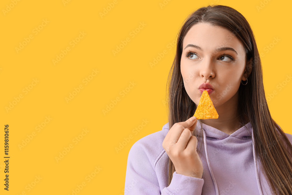 Thoughtful young woman with tasty nacho on yellow background, closeup Thoughtful young woman with tasty nacho on yellow background, closeup