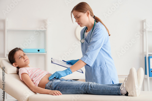 Female doctor examining tee...