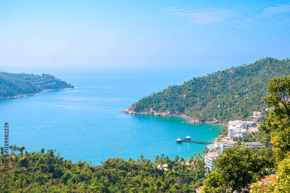 Panoramic view of Puerto Marques Bay in Acapulco, Mexico. This exclusive destination is bordered by dense tropical vegetation. Panoramic view of Puerto Marques Bay in Acapulco, Mexico. This exclusive destination is bordered by dense tropical vegetation.