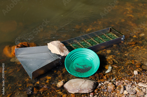 Fototapeta Gold panning and mining in riverbed