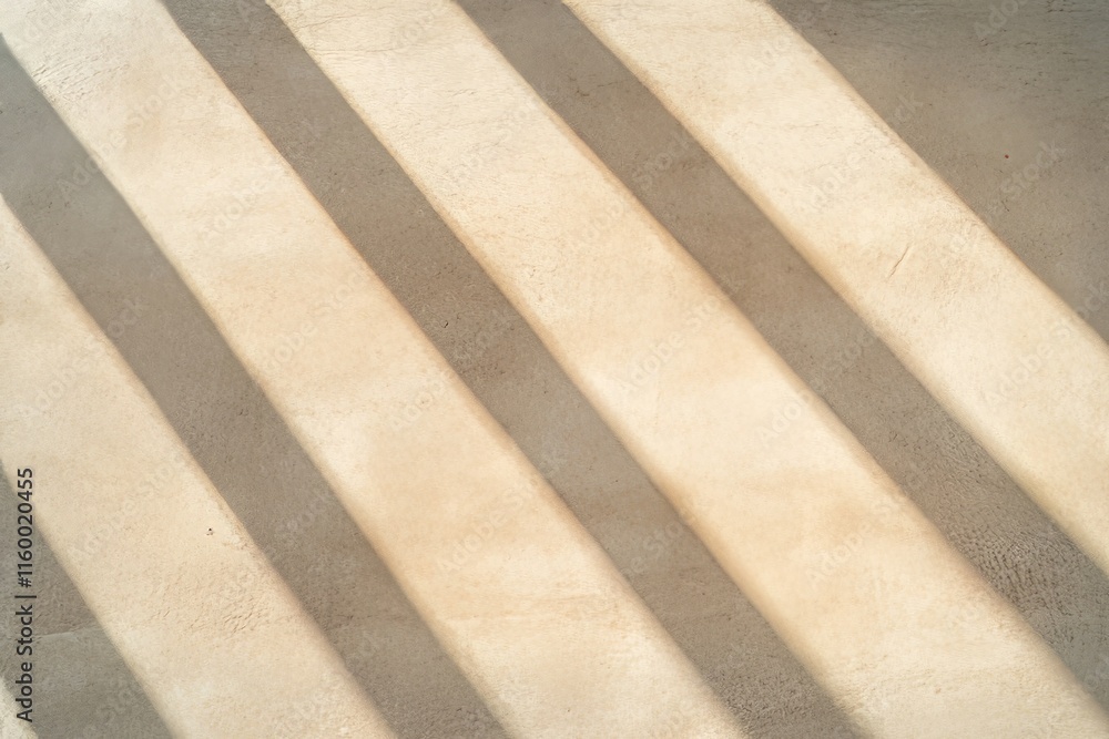 Elegant Diagonal Light and Shadow on a Beige Wall Surface Elegant Diagonal Light and Shadow on a Beige Wall Surface