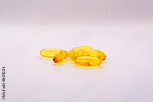 Omega-3 softgel capsules on a white background photo