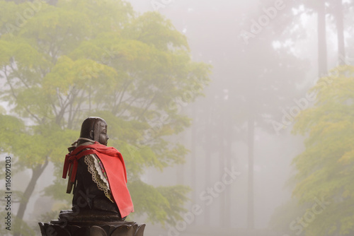 Small Buddha Statue in Mist at Umpenji Temple photo