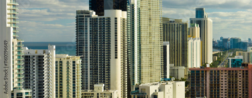 Expensive highrise hotels and condos on Atlantic ocean shore in Sunny Isles Beach city. American tourism infrastructure in southern Florida photo