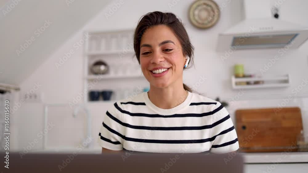 Woman conducting a video call from her home office Woman conducting a video call from her home office
