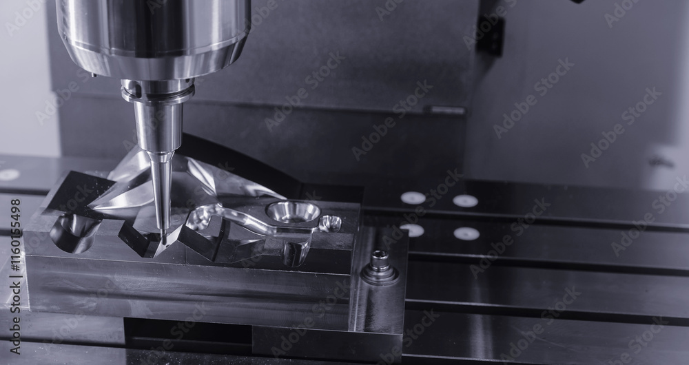 Closeup CNC milling machine during operation. Produced cutting metal parts, banner background of industry heavy factory Closeup CNC milling machine during operation. Produced cutting metal parts, banner background of industry heavy factory