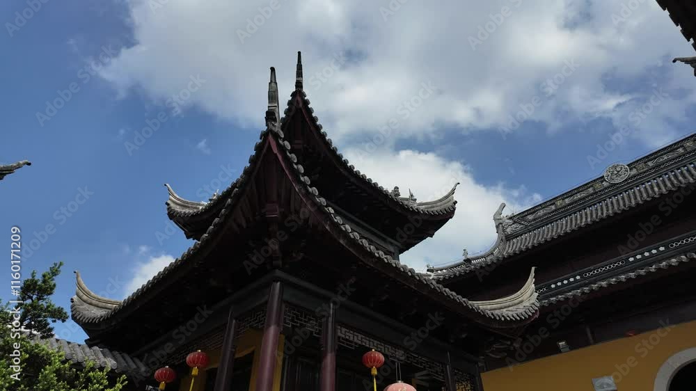 Exploring the beauty of ancient Chinese architecture with eaves under a blue sky and white clouds Exploring the beauty of ancient Chinese architecture with eaves under a blue sky and white clouds