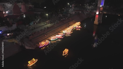 Mahadevghat night view, illuminated boats at Mahadevghat, night photography of Mahadevghat, festive lights on the river, glowing boats in Raipur, Mahadevghat riverside nightlife, reflection of lights. photo