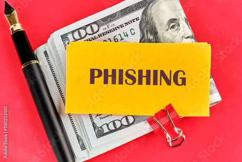 A bold yellow note stating 'Phishing' sits against a backdrop of cash, demonstrating the risks of online scams. This concept raises awareness about technology's impact on financial safety photo