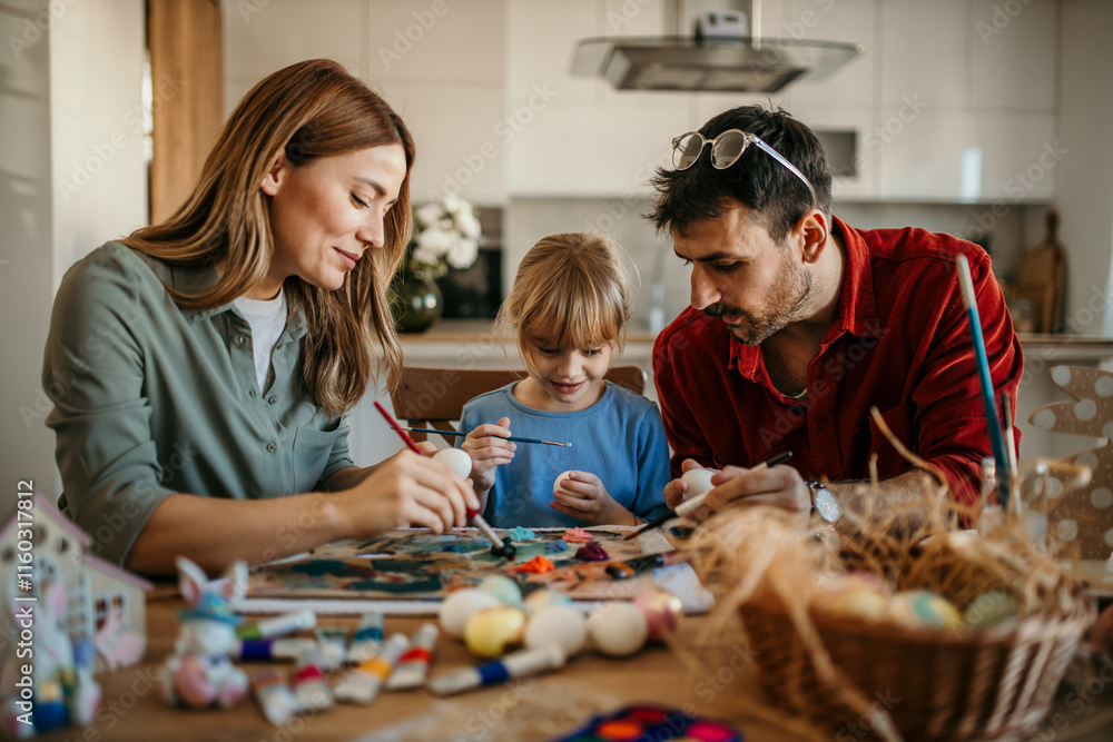 Obraz premium Mom and Dad admiring their kid's artistic Easter egg creations.