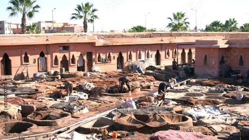 Africa,Morocco, Marrakech 12,28,2024 The Sidi Yacoub tannery inside the Medina souk of Marrakech where leather is colored with ancient and traditional systems of color immersion - tanning of hides  photo