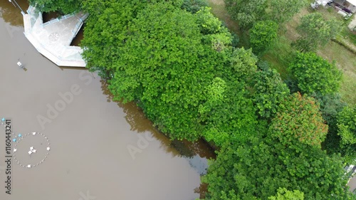 Aerial view of a lake in a city square as a place to relax and unwind with a shady atmosphere shaded by trees photo