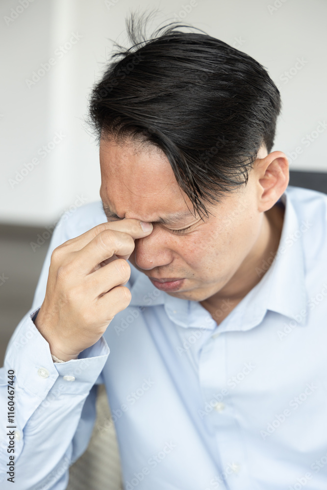 Stressful Asian Man feeling exhausted with failed, bad, negative facial expression Stressful Asian Man feeling exhausted with failed, bad, negative facial expression
