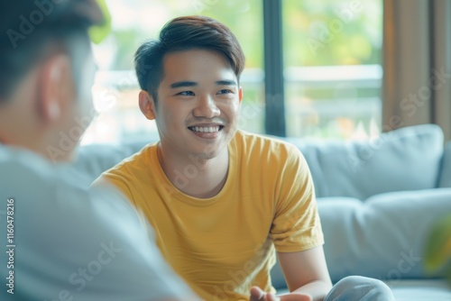 Asian non binary man seeks mental health advice from influencer. photo