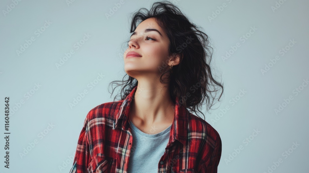 Fototapeta premium Joyful woman standing in casual attire, captured in a relaxed pose with vibrant studio lighting, on solid white background, single object