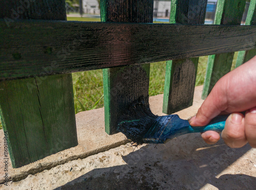 Professional painting with his flat brush beaver green impregnated photo