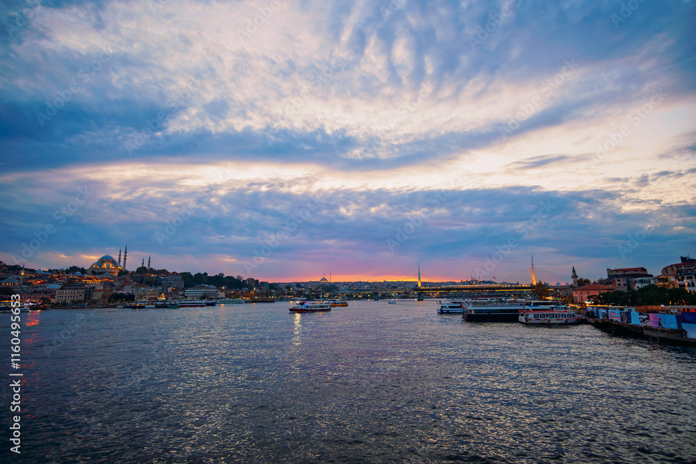 cityscape of Istanbul, Turkey, view to the Golden Horn Bay and architecture of city and ships and Bosphorus shore against the sunset sky, a popular tourist destination cityscape of Istanbul, Turkey, view to the Golden Horn Bay and architecture of city and ships and Bosphorus shore against the sunset sky, a popular tourist destination