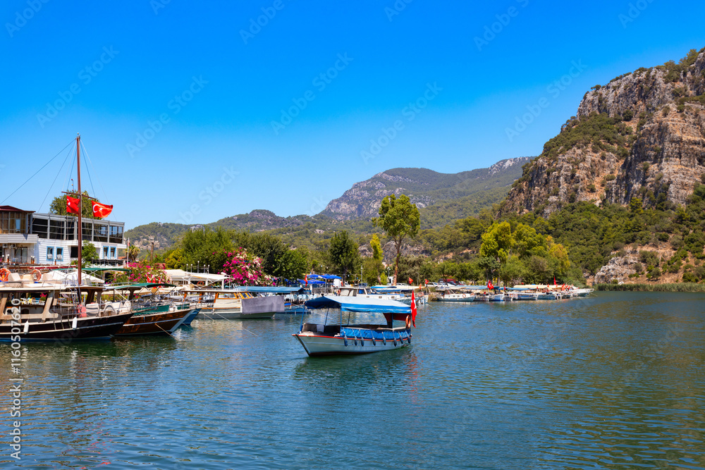 Boats at Dalyan river in Dalyan town, Turkey Boats at Dalyan river in Dalyan town, Turkey