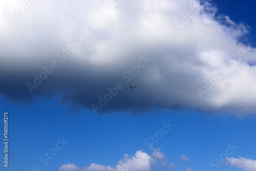 white clouds are floating across the sky