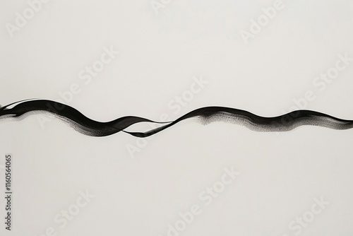 A Single Flowing Black Line Creating a Minimalist Design on a White Background: Simplicity and Artistic Fluidity photo