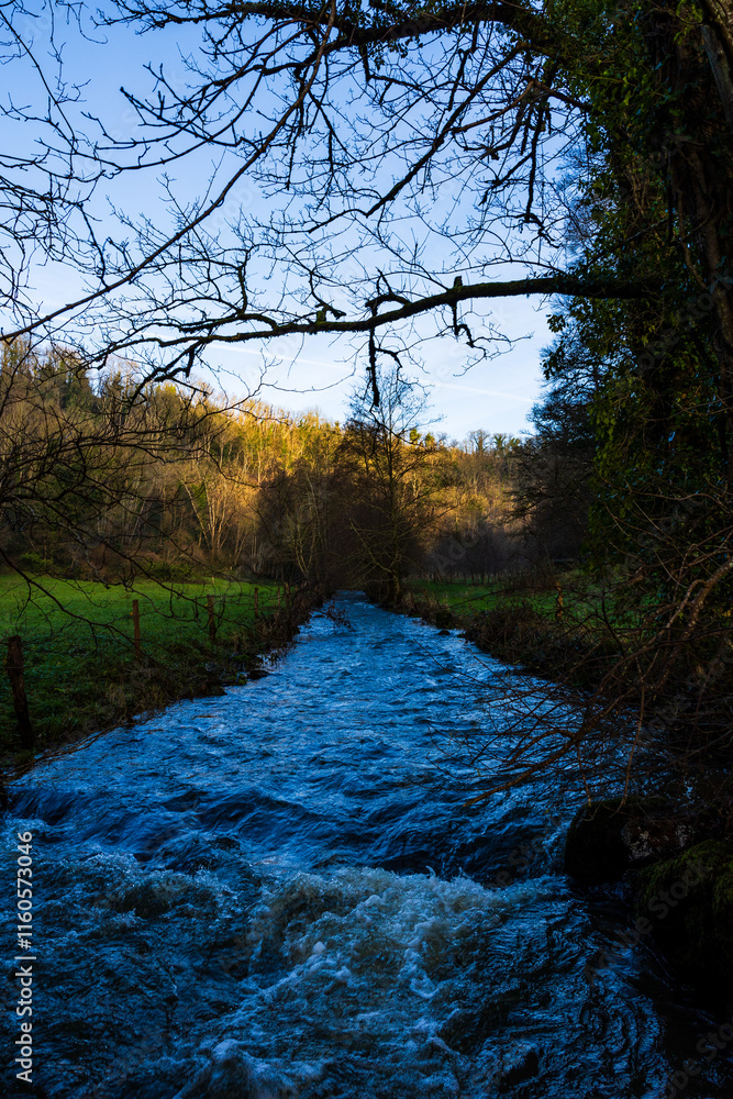 Souleuvre River with high water flow in winter near Le Bény-Bocage Souleuvre River with high water flow in winter near Le Bény-Bocage