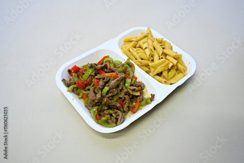 Famous Urfa meat liver, ciger wrapped by lavash with roasted chili pepper, onion and sauce in Sanliurfa, Turkey. Kuzu et ciger sis. Izgara dana bonfile, cop sis, kuzu pirzola. Karisik kebap, beyti keb photo